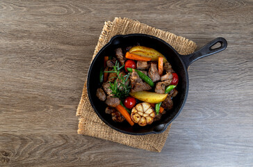 meat stew with mixed vegetables in a hot plate.