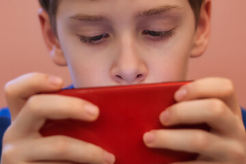 Close-up of a teenager's eyes staring at a smartphone