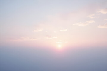 Fototapeta premium Ethereal Pastel Sunrise with Delicate Cloud Formation in Morning Sky
