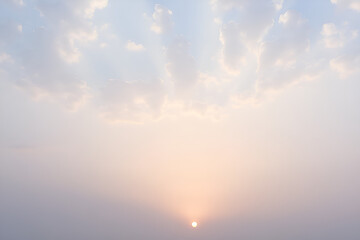Fototapeta premium Misty Golden Sunrise Breaking Through Morning Haze Over Horizon