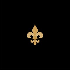  Fleur de lis gold icon isolated on dark background © sljubisa