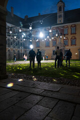 Brixen, South Tyrol, Northern Italy - 2024: Blurred photo with people in Water Light Festival inside the historic center of the old city of Brixen (Bressanone) in South Tyrol - Sudtirol - Alto Adige.