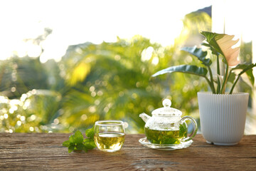 herbs tea, coriander, Lemon balm, Rice Paddy Herb in a glass teapot