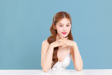 Pretty Asian beauty woman curly long hair with Korean makeup glowing face and healthy facial skin...