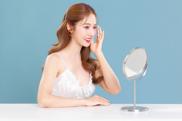 Pretty Asian beauty woman curly long hair with Korean makeup glowing face and healthy facial skin...