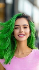 Obraz premium Smiling young woman with vibrant green hair, wearing a pink shirt, radiating joy and confidence outdoors.