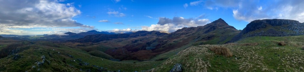 Panoramic view of rolling hills and the mountains of Penrhyndeudraeth and Croesor in Snowdonia (Eryri) National Park, Wales, UK, captured during a winter hike.