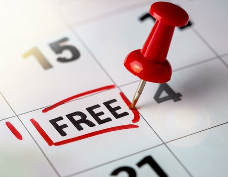 Closeup photo of mark on calendar at fifteenth red inscription free time with red pushpin