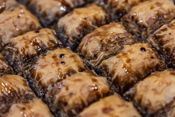 Baclava layered pastry dessert made of filo pastry, filled with chopped nuts, and sweetened with syrup or honey. Baclava or pakhlava the sweet pastries of Ottoman, Arabian, Persian and Greek cuisine