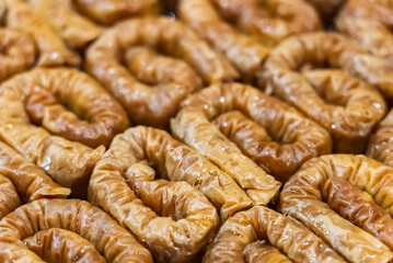 Baclava layered pastry dessert made of filo pastry, filled with chopped nuts, and sweetened with syrup or honey. Baclava or pakhlava the sweet pastries of Ottoman, Arabian, Persian and Greek cuisine