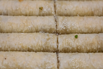 Baclava layered pastry dessert made of filo pastry, filled with chopped nuts, and sweetened with syrup or honey. Baclava or pakhlava the sweet pastries of Ottoman, Arabian, Persian and Greek cuisine