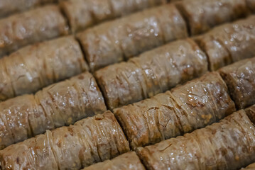 Baclava layered pastry dessert made of filo pastry, filled with chopped nuts, and sweetened with syrup or honey. Baclava or pakhlava the sweet pastries of Ottoman, Arabian, Persian and Greek cuisine
