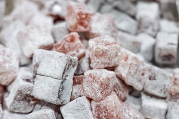 Turkish delight or lokum, halgoum is a family of confections with starch and sugar. Premium turkish delight. Famous turkish and greek sweet dessert. Turkish delight close up shot of colorful sweets.