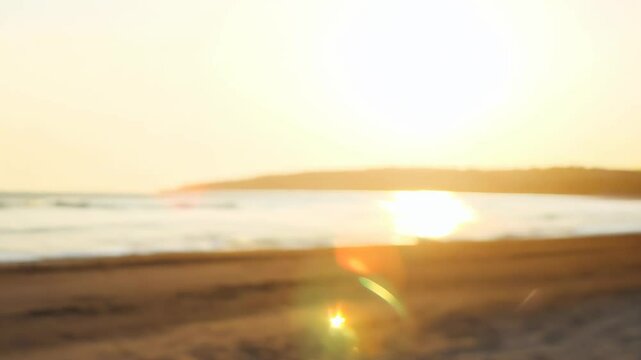 video of a stunning sunrise on the beach and a close-up of a person appearing in the frame