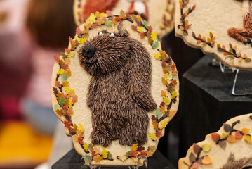 Christmas gingerbread. Artistic gingerbread made in a festive atmosphere. Colorful gingerbread with handmade patterns. Beautifully made Christmas cookies. Handmade gingerbread with animals.