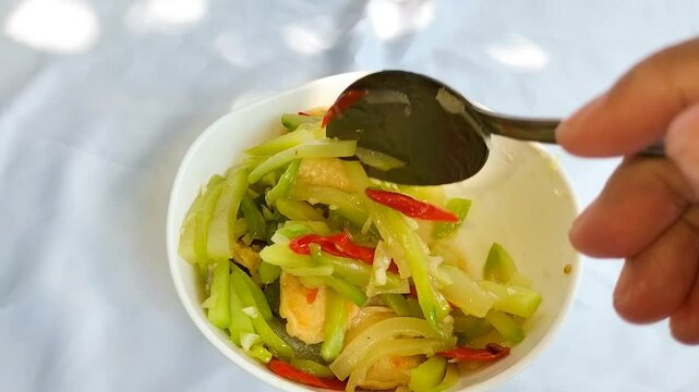Footage of traditional indonesian food. Asian culinary sayur jipang or stir fry chayote or tumis labu siam.
