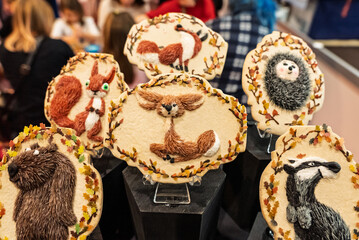 Christmas gingerbread. Artistic gingerbread made in a festive atmosphere. Colorful gingerbread with handmade patterns. Beautifully made Christmas cookies. Handmade gingerbread with animals.