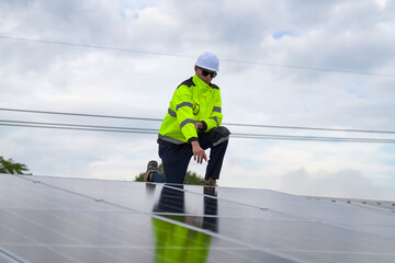 Men technicians mounting photovoltaic solar moduls on roof of house.