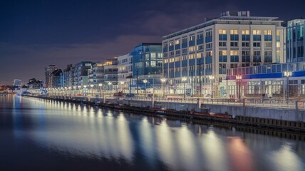 Night View of Busy Waterfront Promenade with Glowing City Reflections