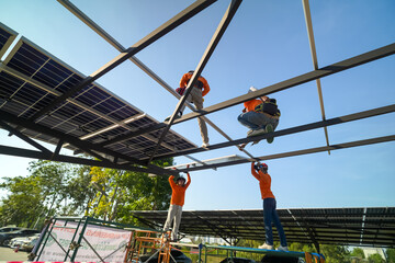 Fototapeta premium Renewable Energy Eco Technology Electric Power. Worker assemble energy system with solar panel for electricity.(Multiple values)