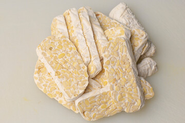 Stack the tempeh slices. Traditional food from fermented soybeans becomes tempeh.