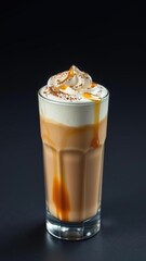 Frothy whipped dalgona coffee topped with a sprinkle of cocoa powder and a drizzle of honey in a tall clear glass, honey, dessert drink