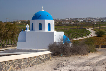Typical church with blue cupola between Emporio and Akrotiri, Santorini island, Greece