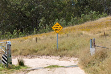 Photograph of a 4 Wheel Drive off-road safety sign on a dirt track in a remote area of the Blue...