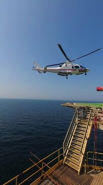 helicopter landing On helideck of  the offshore oil rig 