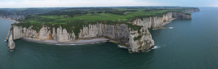 Aerial view of the famous white limestone cliffs near Etretat during sunset, France