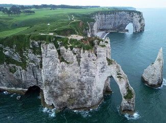 Aerial view of the famous white limestone cliffs near Etretat during sunset, France