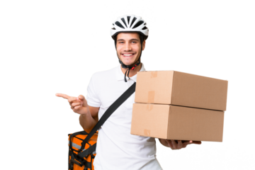 Delivery man wearing a helmet bike over isolated background pointing finger to the side