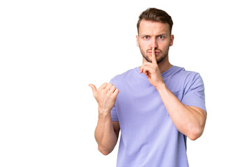 Young handsome caucasian man over isolated chroma key background pointing to the side and doing...