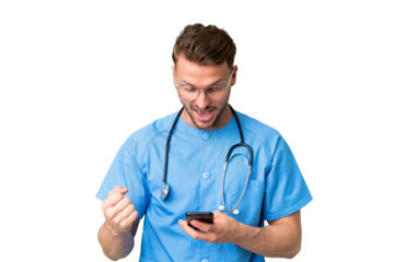 Young nurse man over isolated chroma key background surprised and sending a message