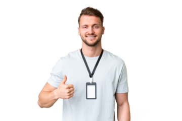 Young caucasian man with ID card over isolated chroma key background giving a thumbs up gesture
