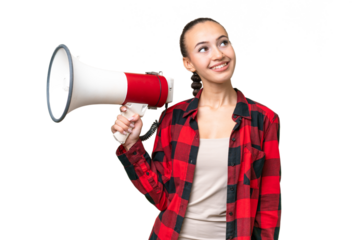 Young Arab woman over isolated background holding a megaphone and looking up while smiling