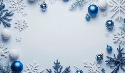 Fototapeta premium A blue and white Christmas background with snowflakes, blue ornaments and decorations on the ground.