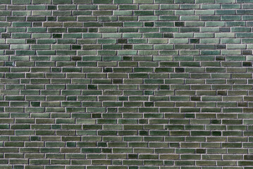 Backsteinwand in gr&uuml;n