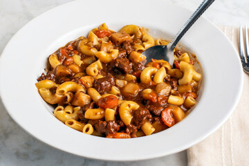 macaroni  mixed with beef stew