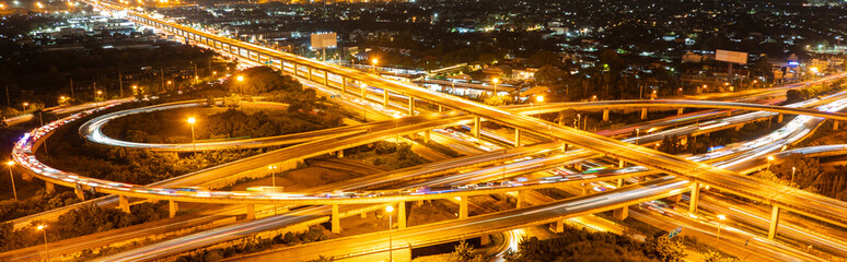 Fototapeta premium Expressway top view, Road traffic an important infrastructure, Urban cityscape concept or abstract of advanced innovation, financial technology, energy power, expressway