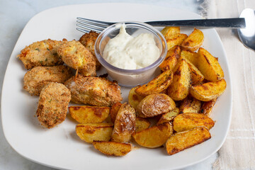 haddock  bites  with potato wedges