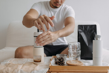 Step by step of Asian man making espresso with hand press tools.