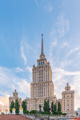 high-rise stalinist building near river at summer sunset in Moscow, Russia. Historic name is Hotel Ukraine.