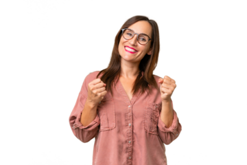 Middle-aged caucasian woman over isolated background celebrating a victory in winner position