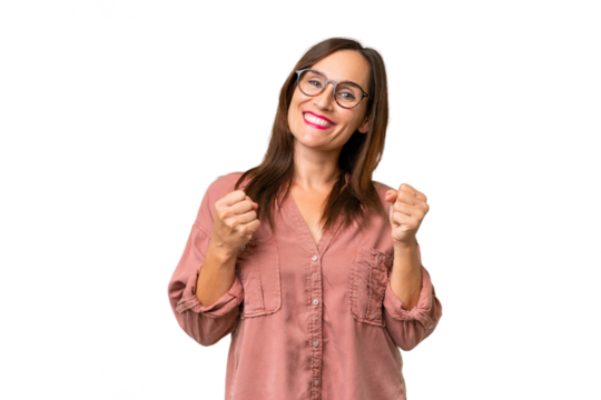 Middle-aged caucasian woman over isolated background celebrating a victory in winner position