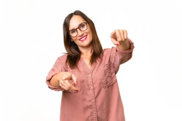 Middle-aged caucasian woman over isolated background pointing front with happy expression