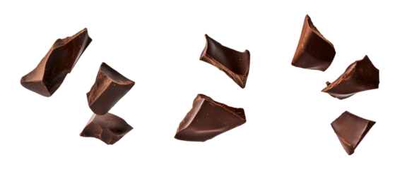 Pieces of dark chocolate floating in the air, on a transparent background.