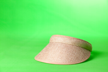 Visor on green background. Visor concept. Hat concept. copy space.