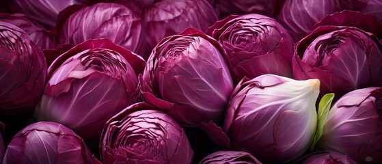 Obraz premium Close-Up of Vibrant Red Cabbages in a Rustic Display Setting