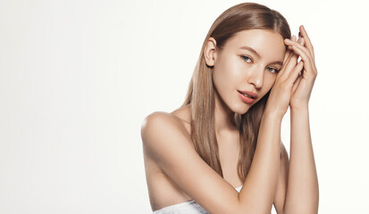 Skincare and Beauty Campaign. Young Beautiful Woman with Radian Skin, applying Cosmetic Product on...